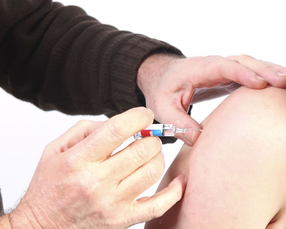 person getting a vaccination shot