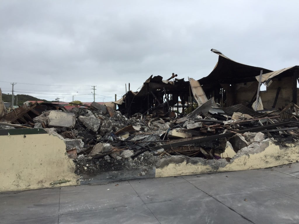 Rubble: the King Island pharmacy will rebulid, says owners