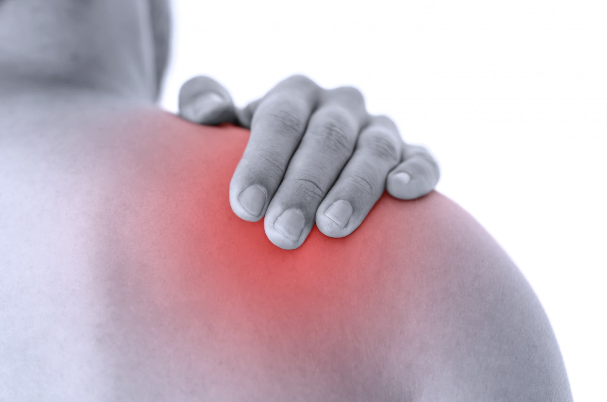 Man rubs sore shoulder