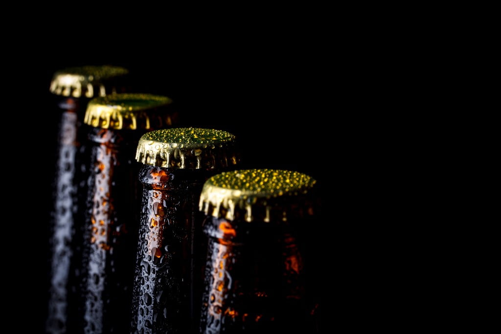 liquor outlets: beer bottles in a row