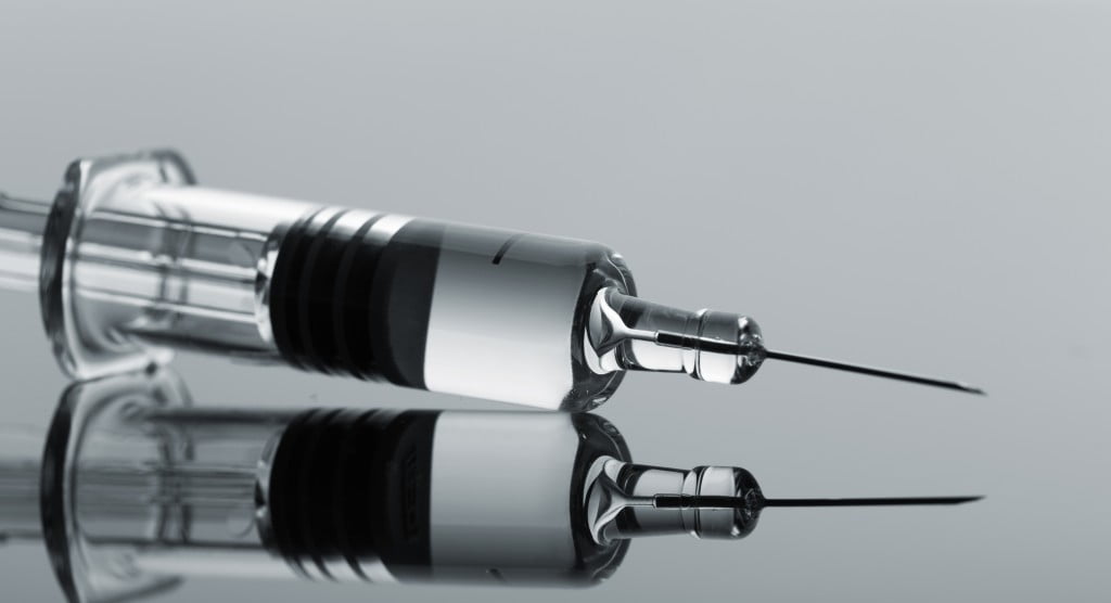 vaccine sitting on a grey surface: QPIP