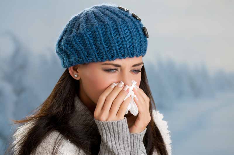 Apotex: woman blowing nose