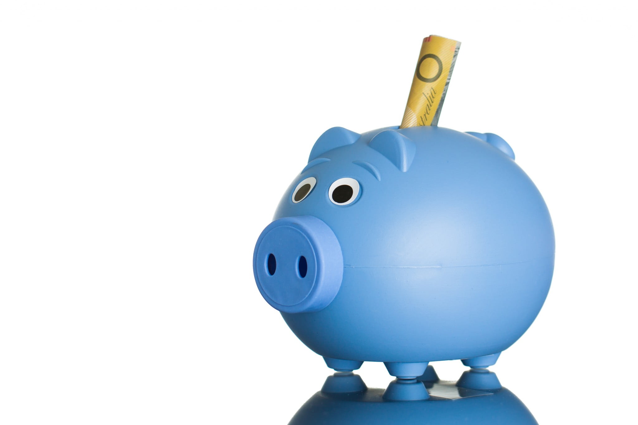 $50 note sticks out of blue piggybank