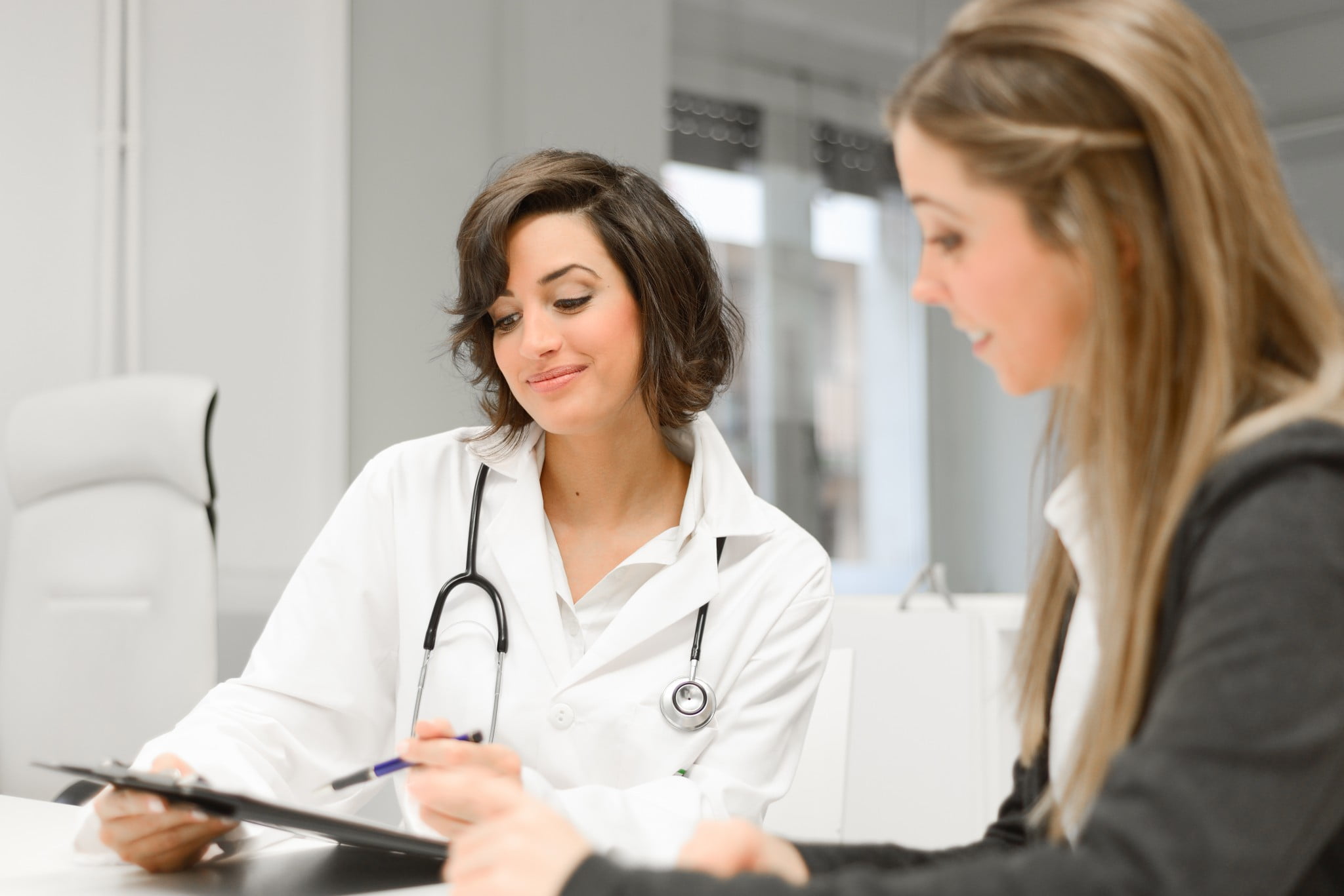 GP explaining file to patient