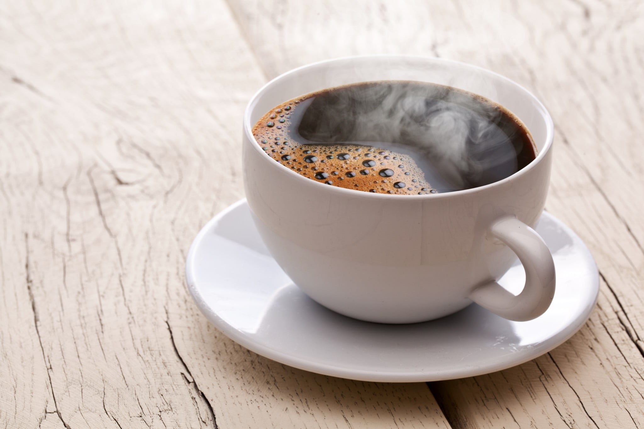 steaming cup of black coffee