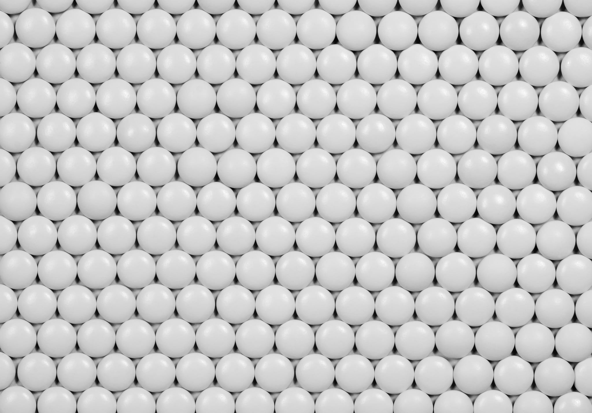 lots of tiny aspirin pills