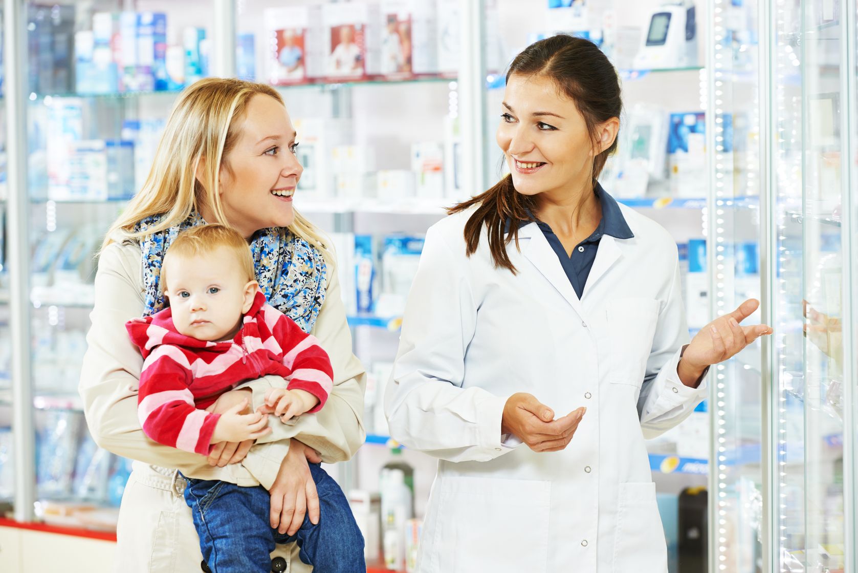 women in pharmacy: pharmacist with a woman with baby