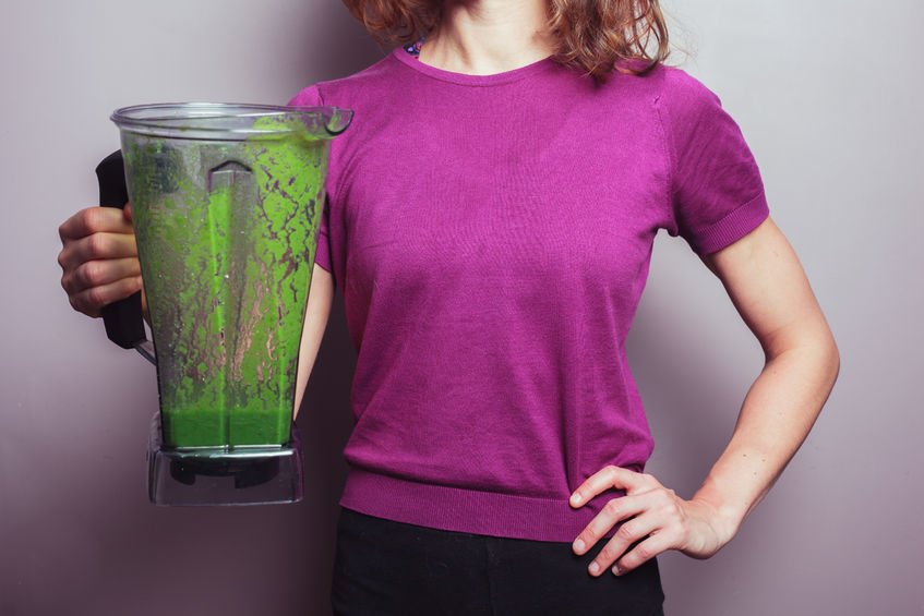 woman with pitcher of unpleasant green dietary cures