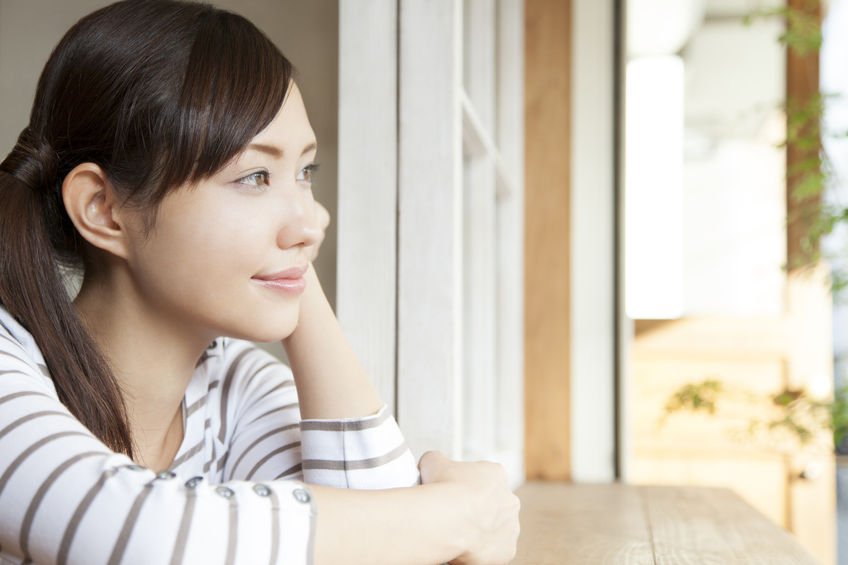 woman smiling at window - mental health story
