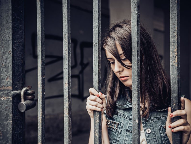 woman behind bars