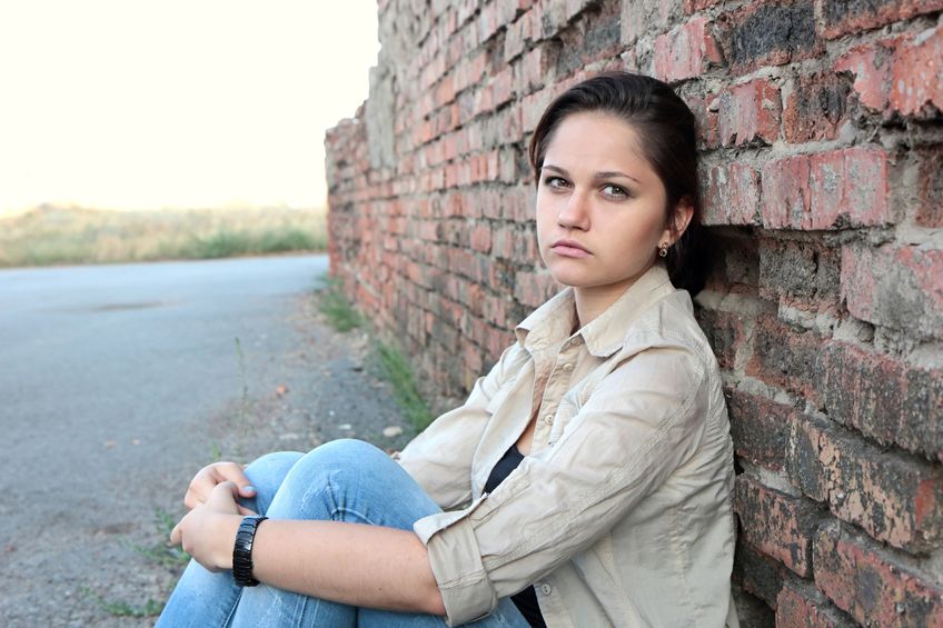 sad girl by wall