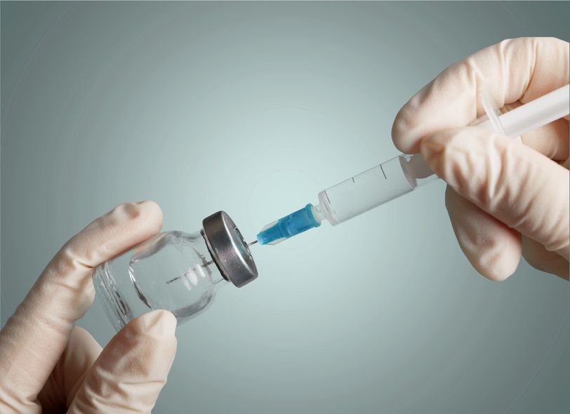 vaccination - vaccine bottle and needle