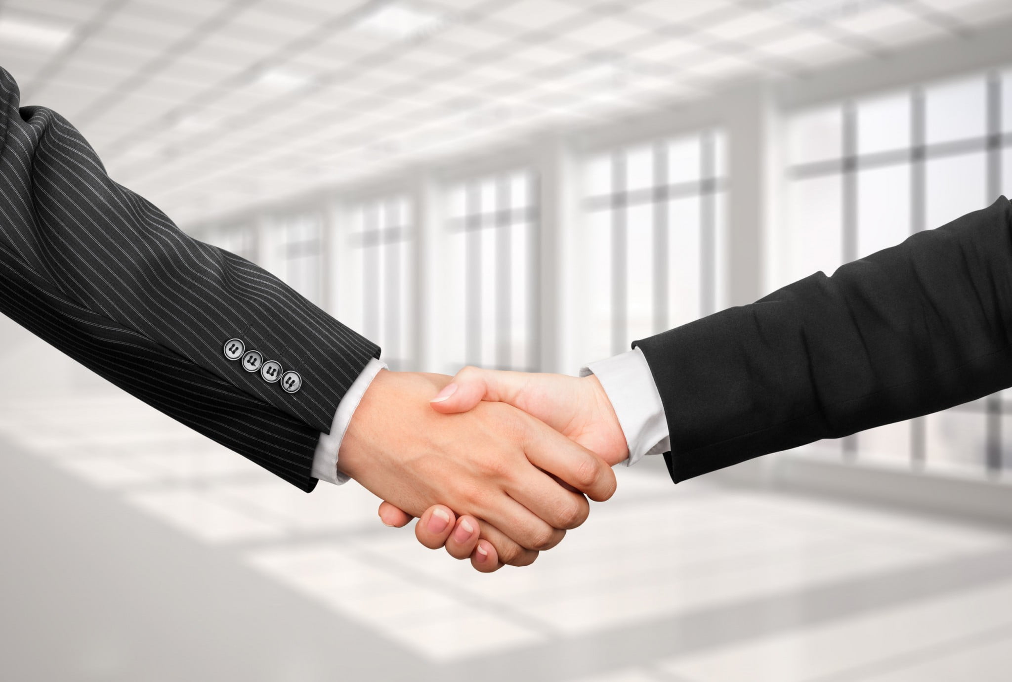man and woman shaking hands