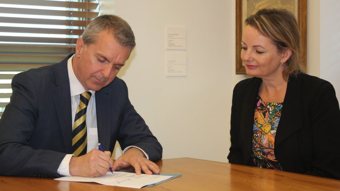 George Tambassis and Sussan Ley sign the 6CPA