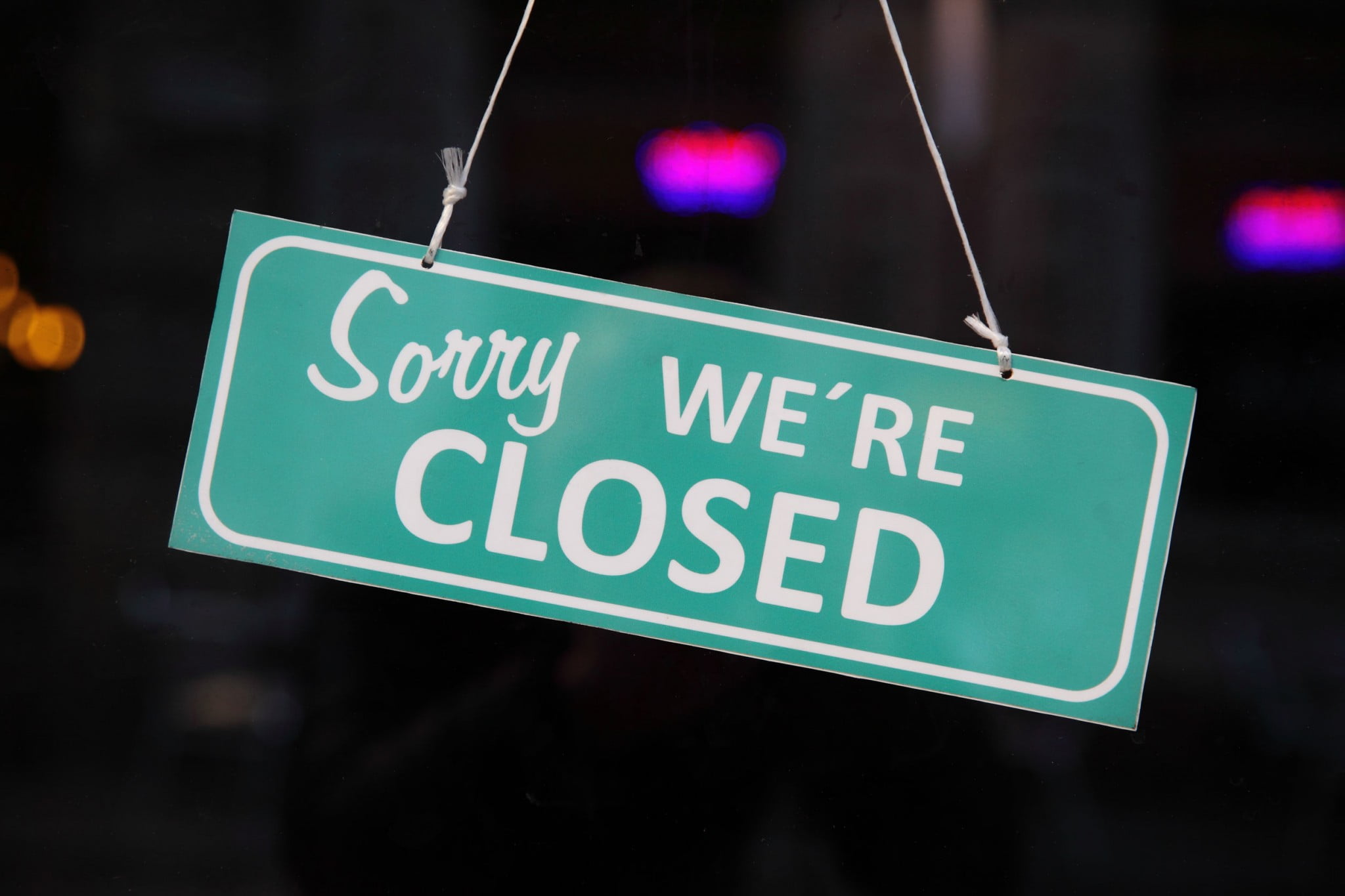 "closed" sign on door