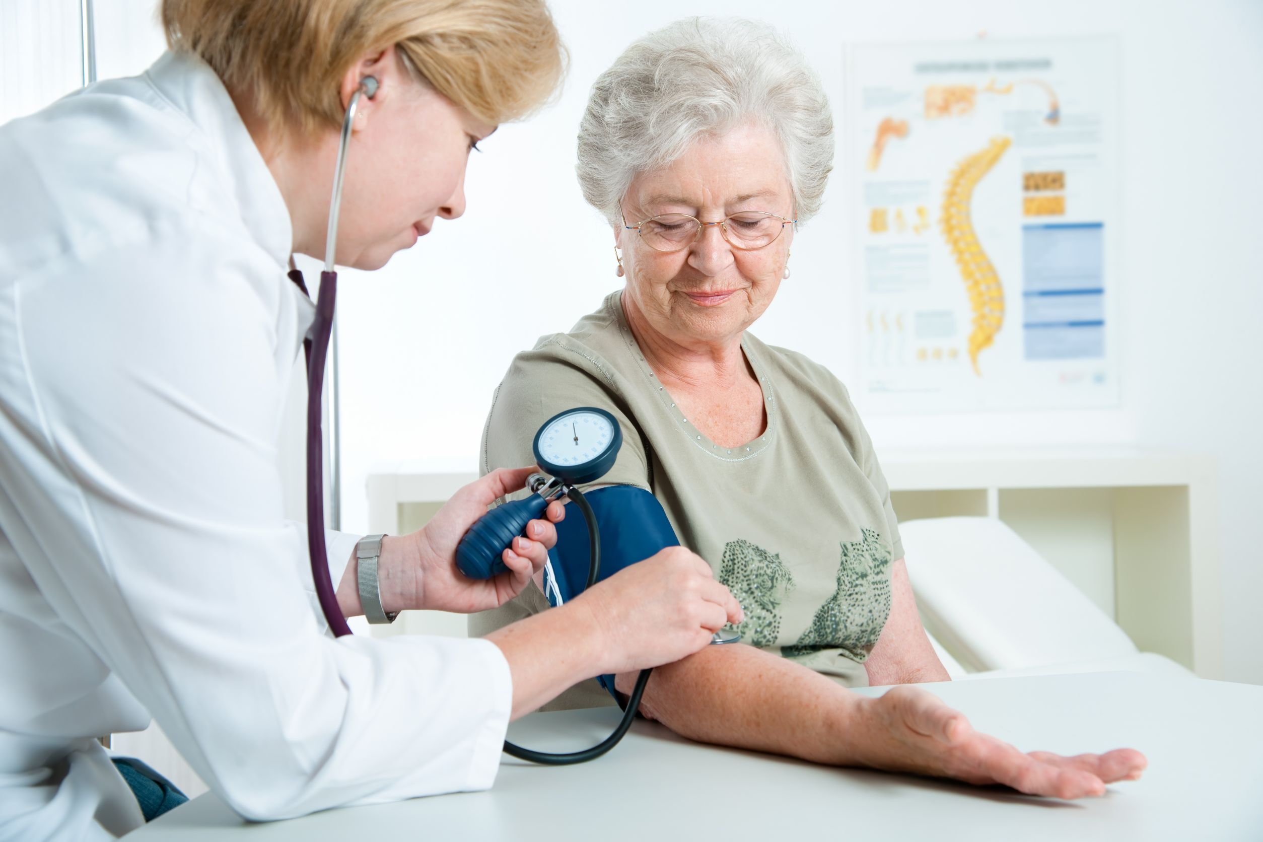 senior woman having blood pressure check