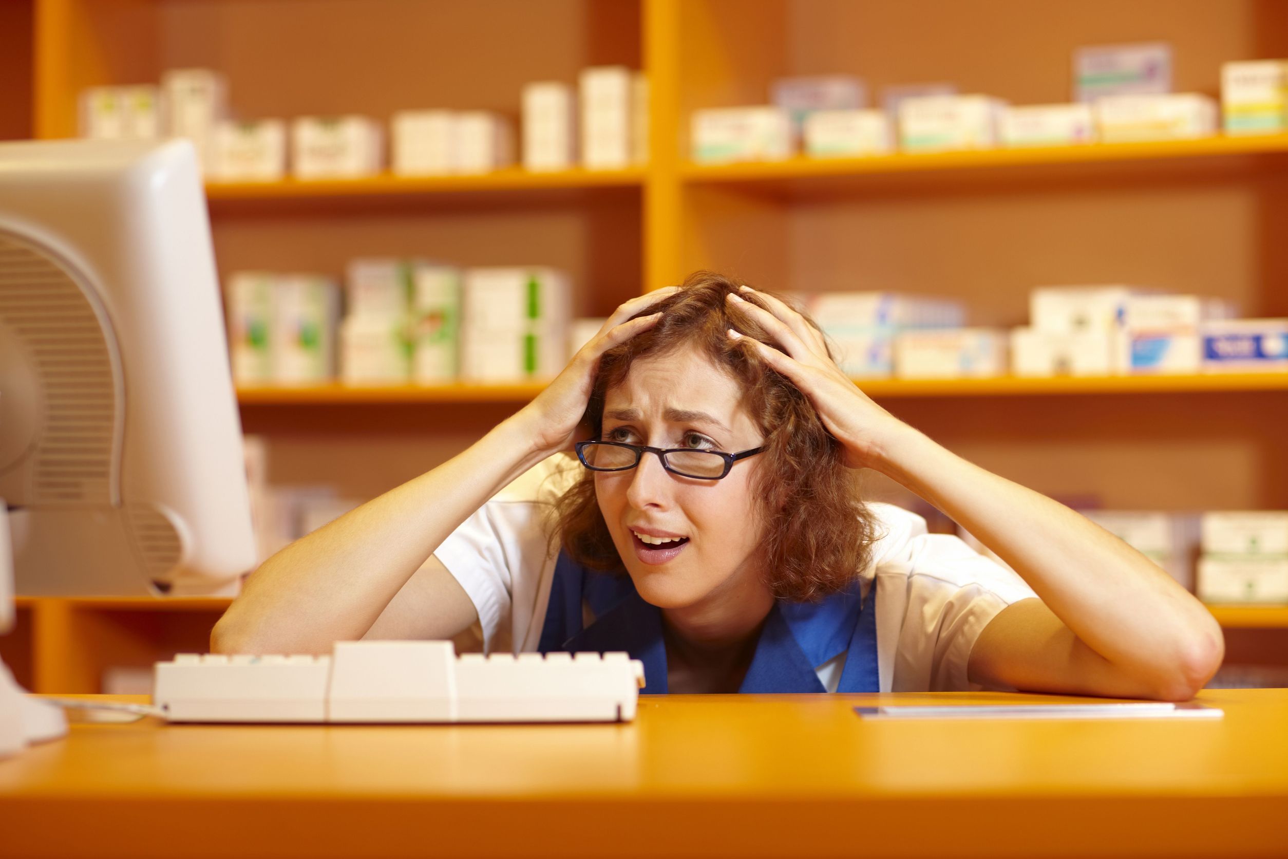 Stressed pharmacist in dispensary