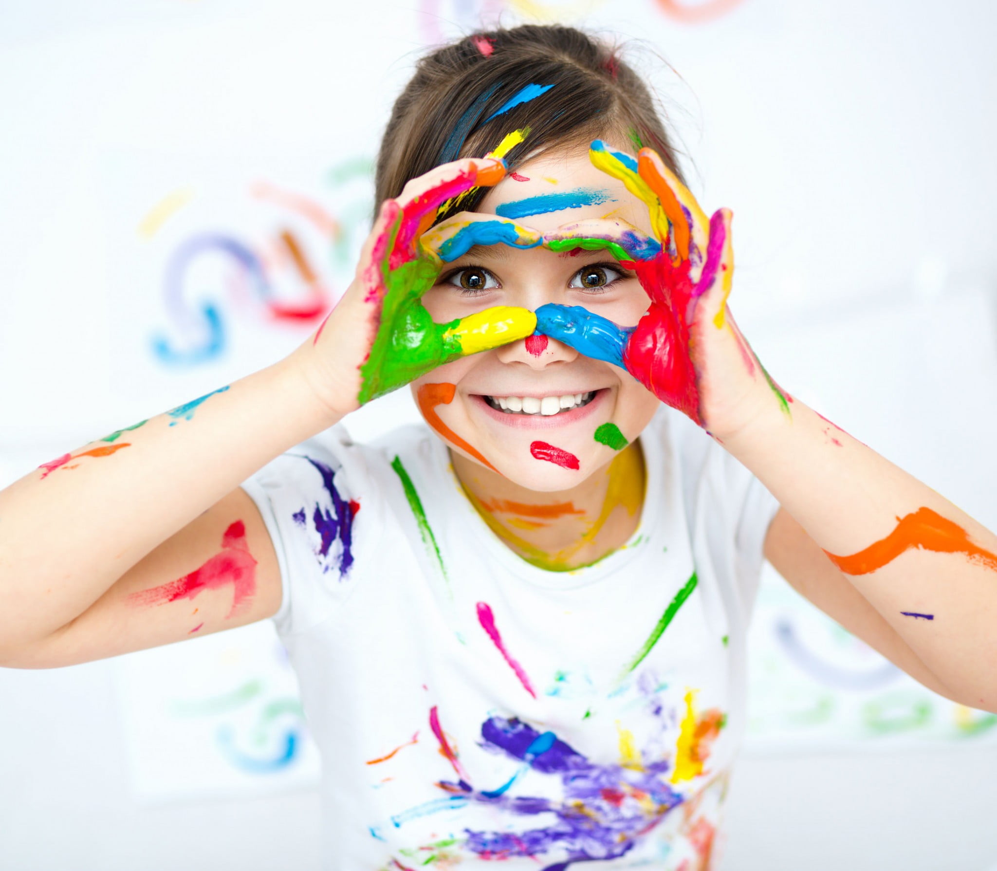Little girl playing with paint