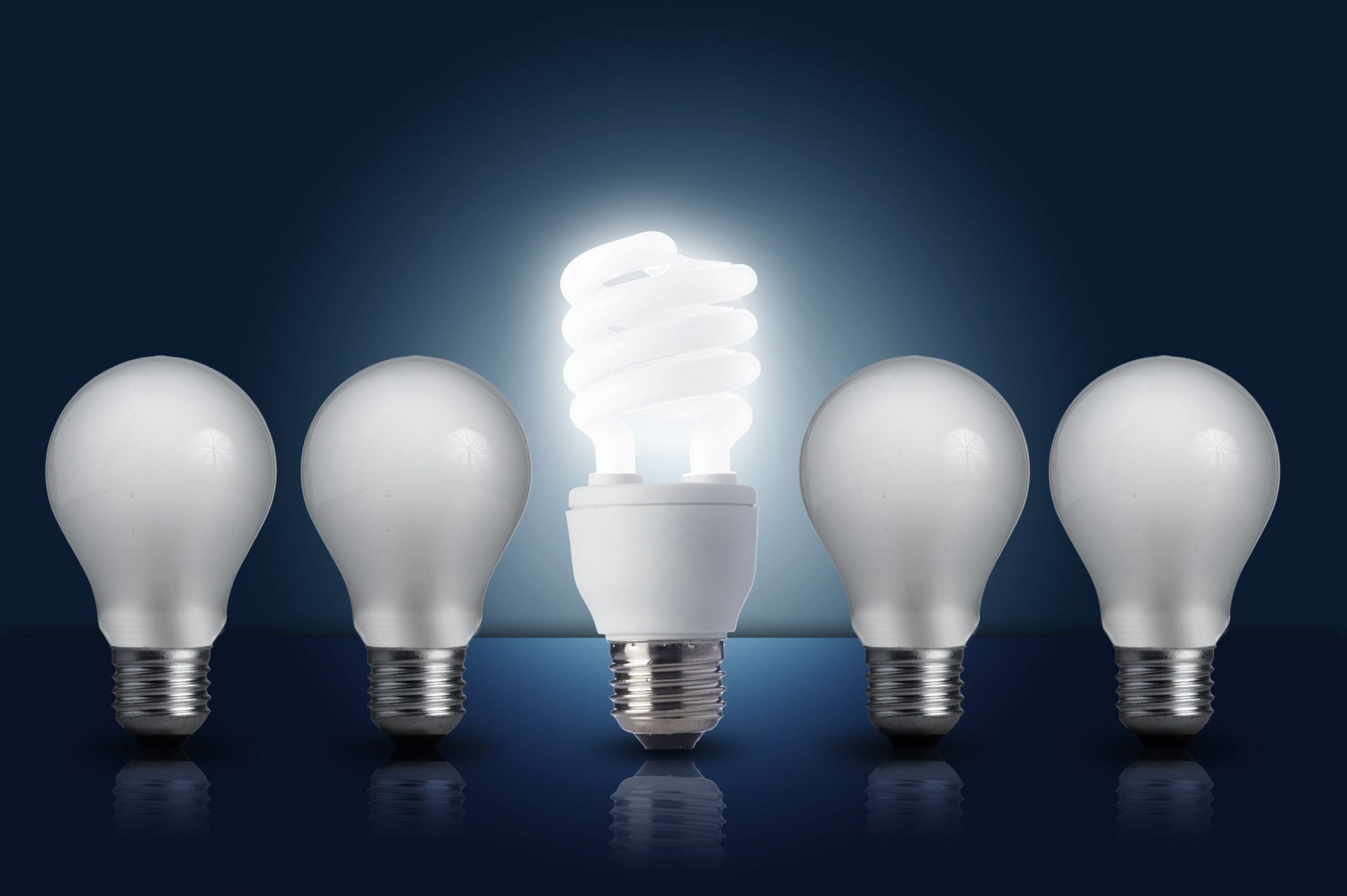 old bulbs with a smart bulb in middle