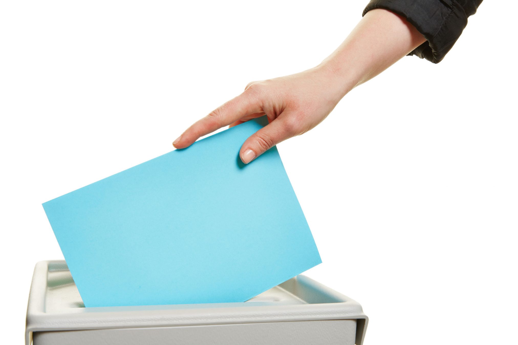 43403276 - female hand casting vote at election with ballot paper at box