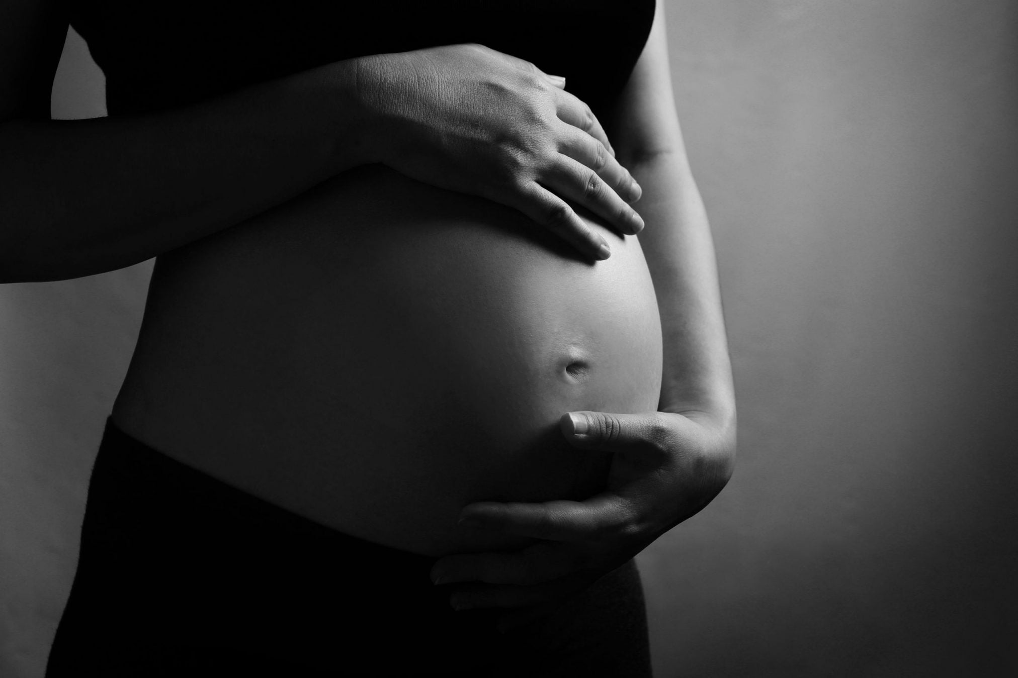 monochrome of pregnant belly