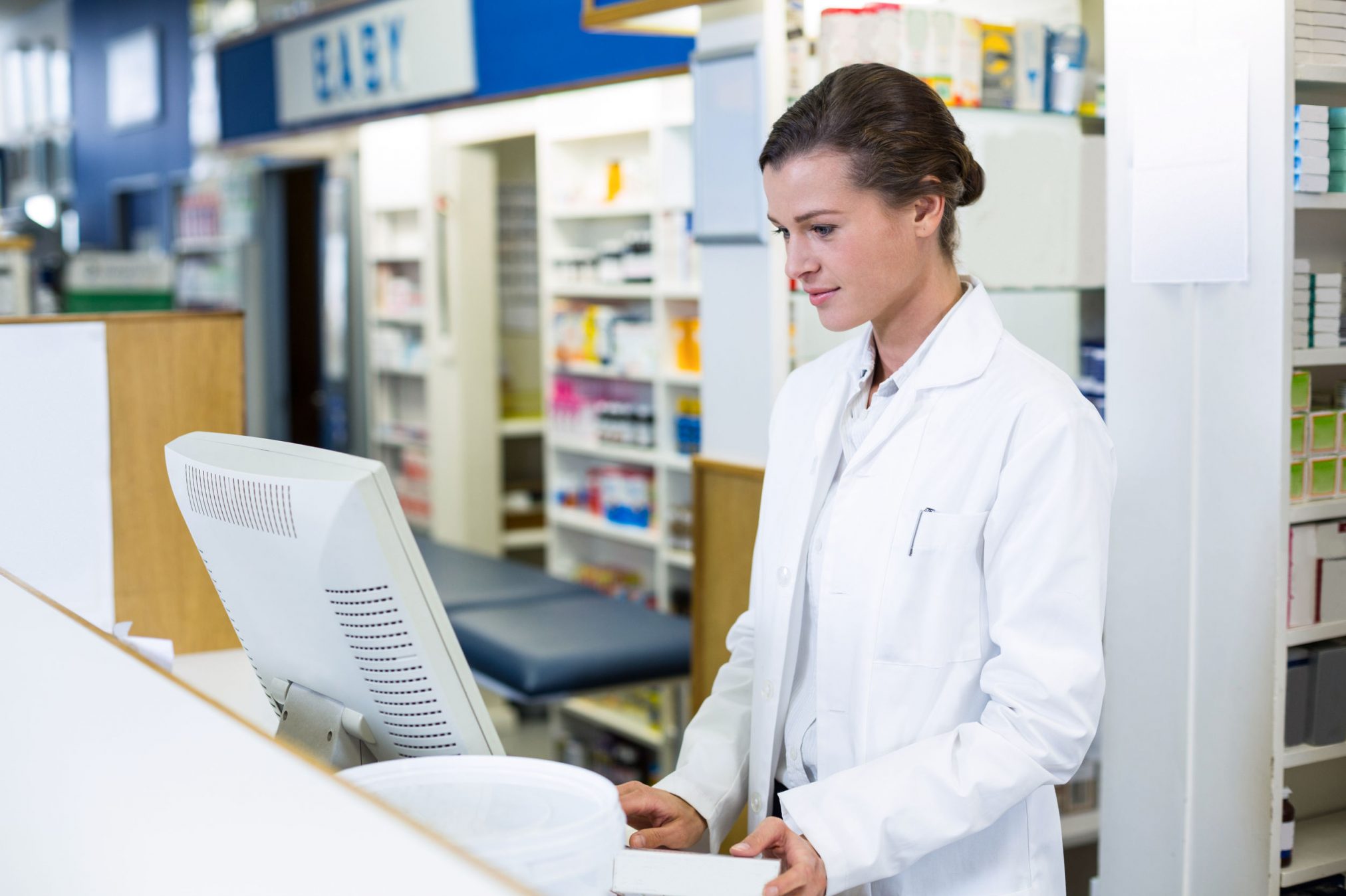 Pharmacist using computer
