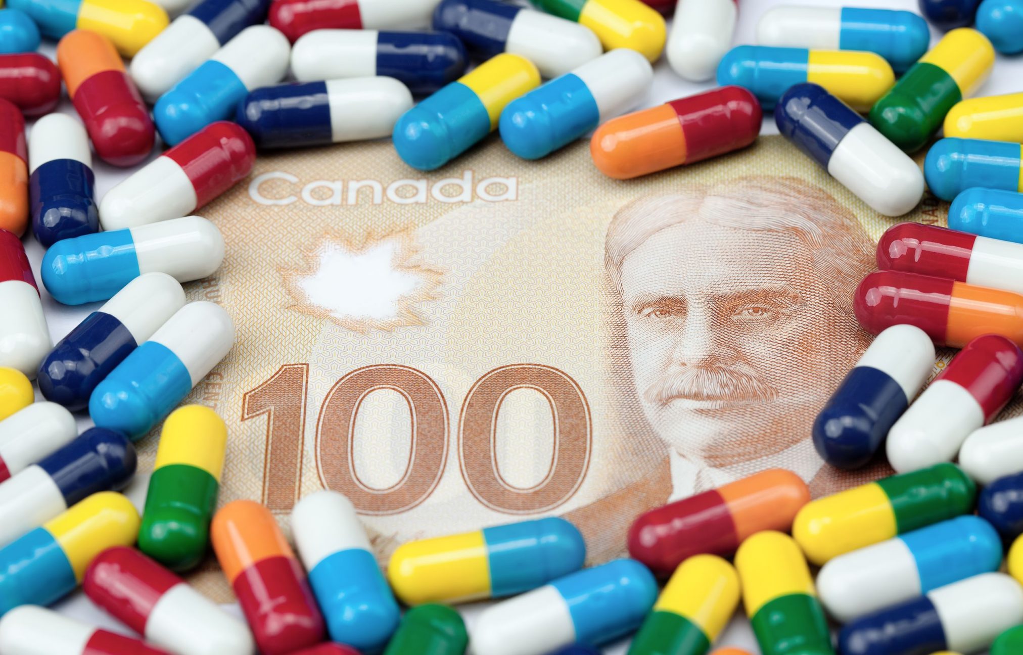 pills on canadian $100 bill