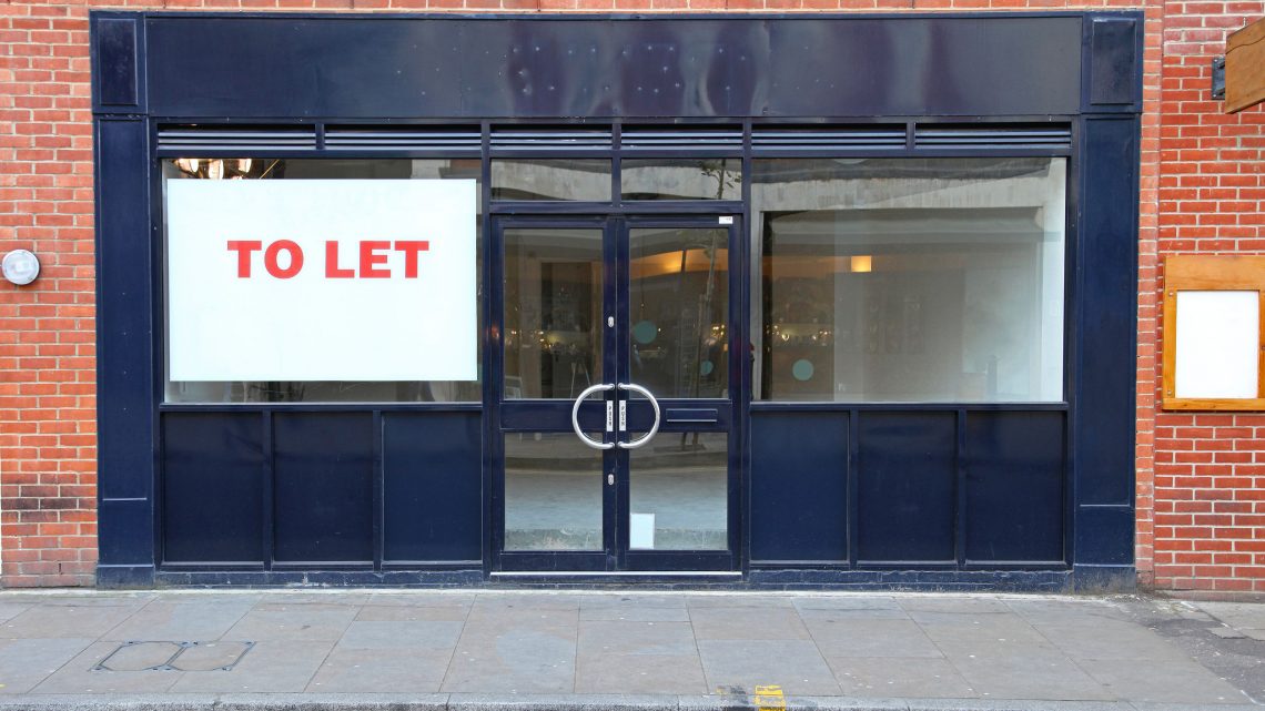 empty shop with to let sign