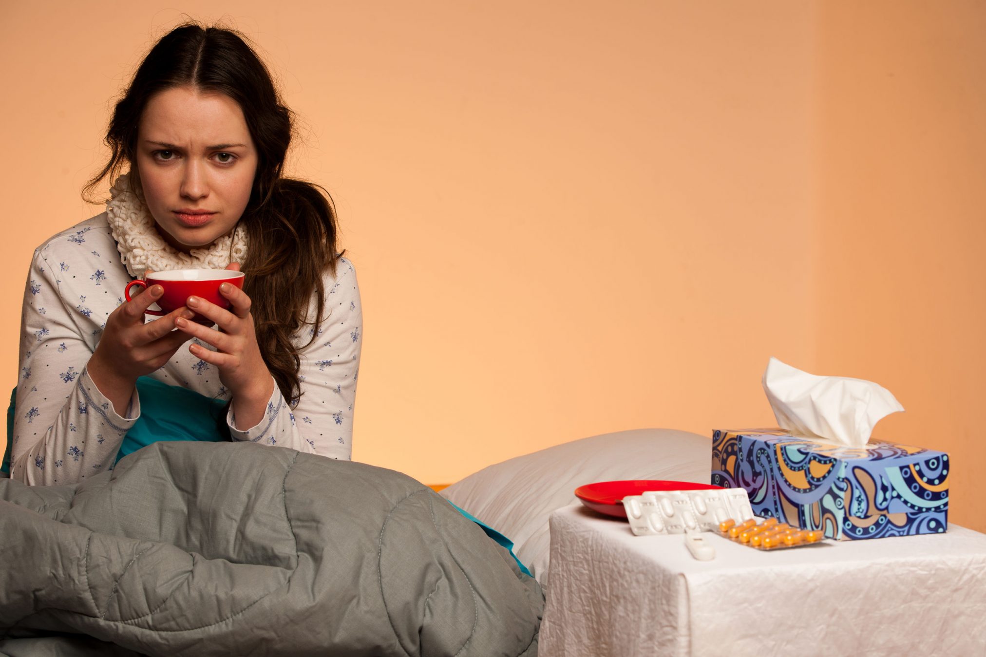 Woman in bed with flu