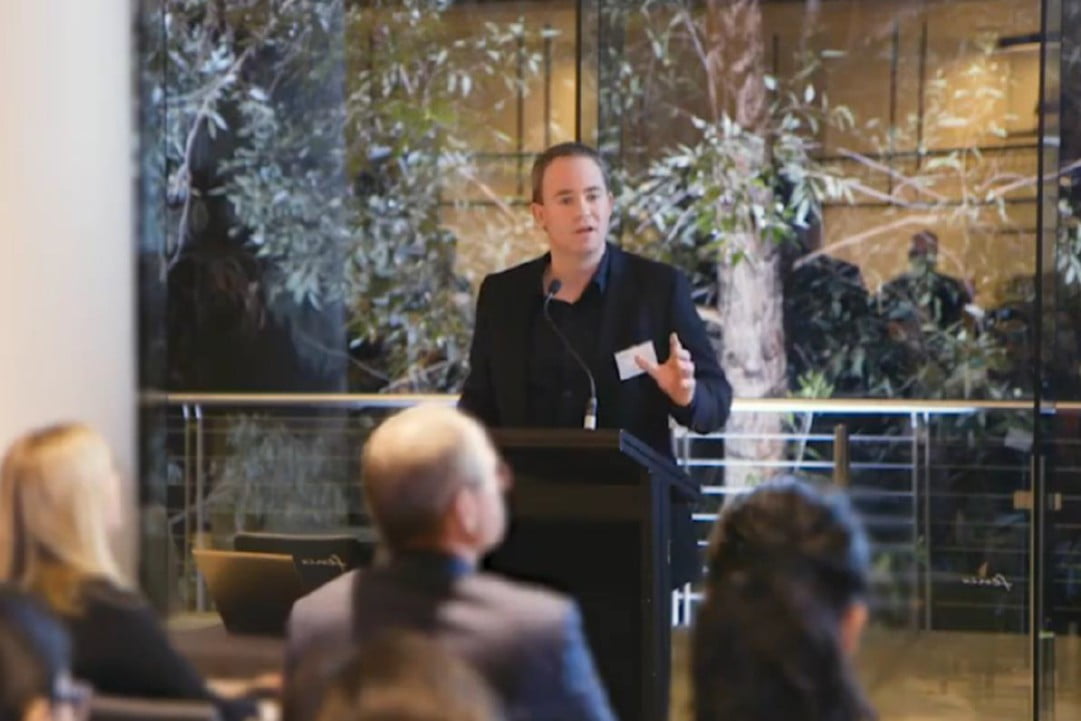 Luke McKinnon presents at a Symbion forum.