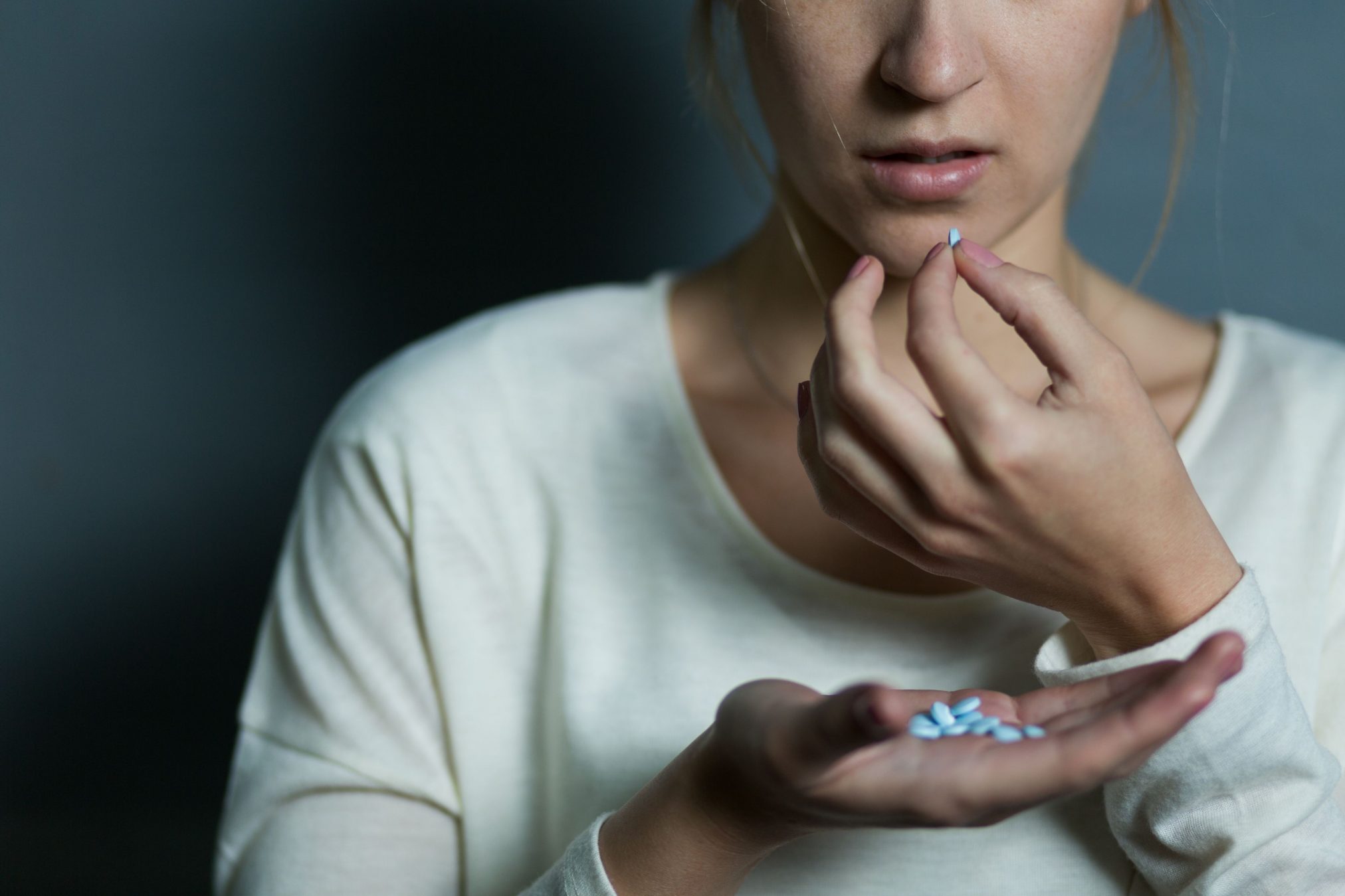 woman taking pills