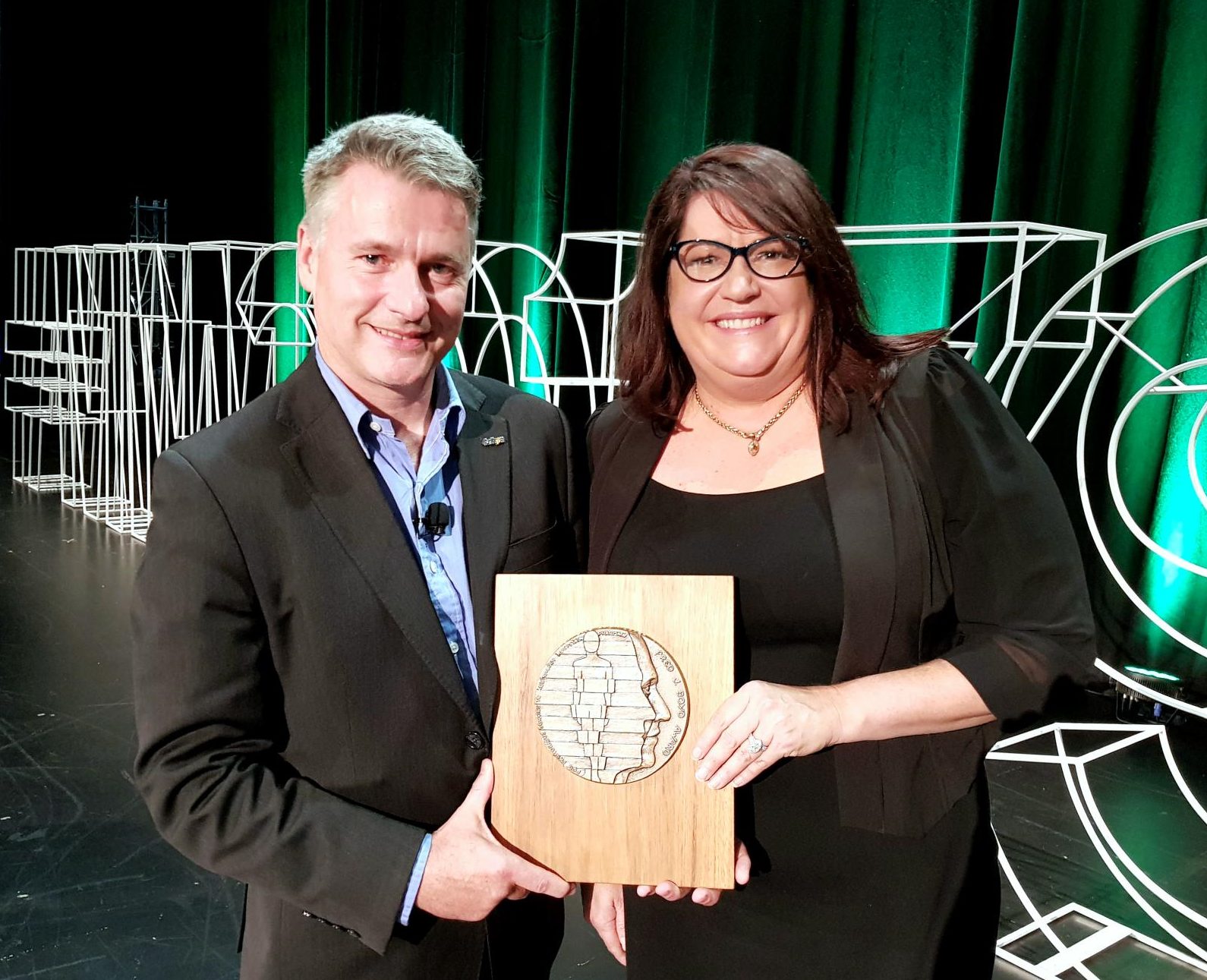 Professor Michael Dooley and Dr Danielle Stowasser with her award.