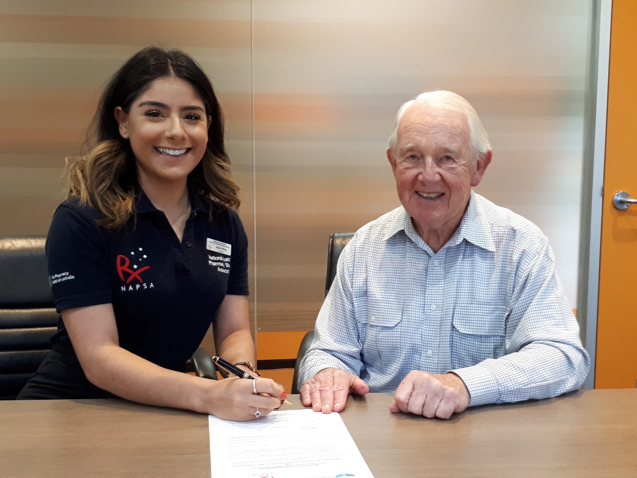 Sandra Minas and John Coppock sign the MoU.