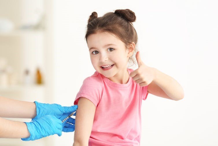happy child being vaccinated