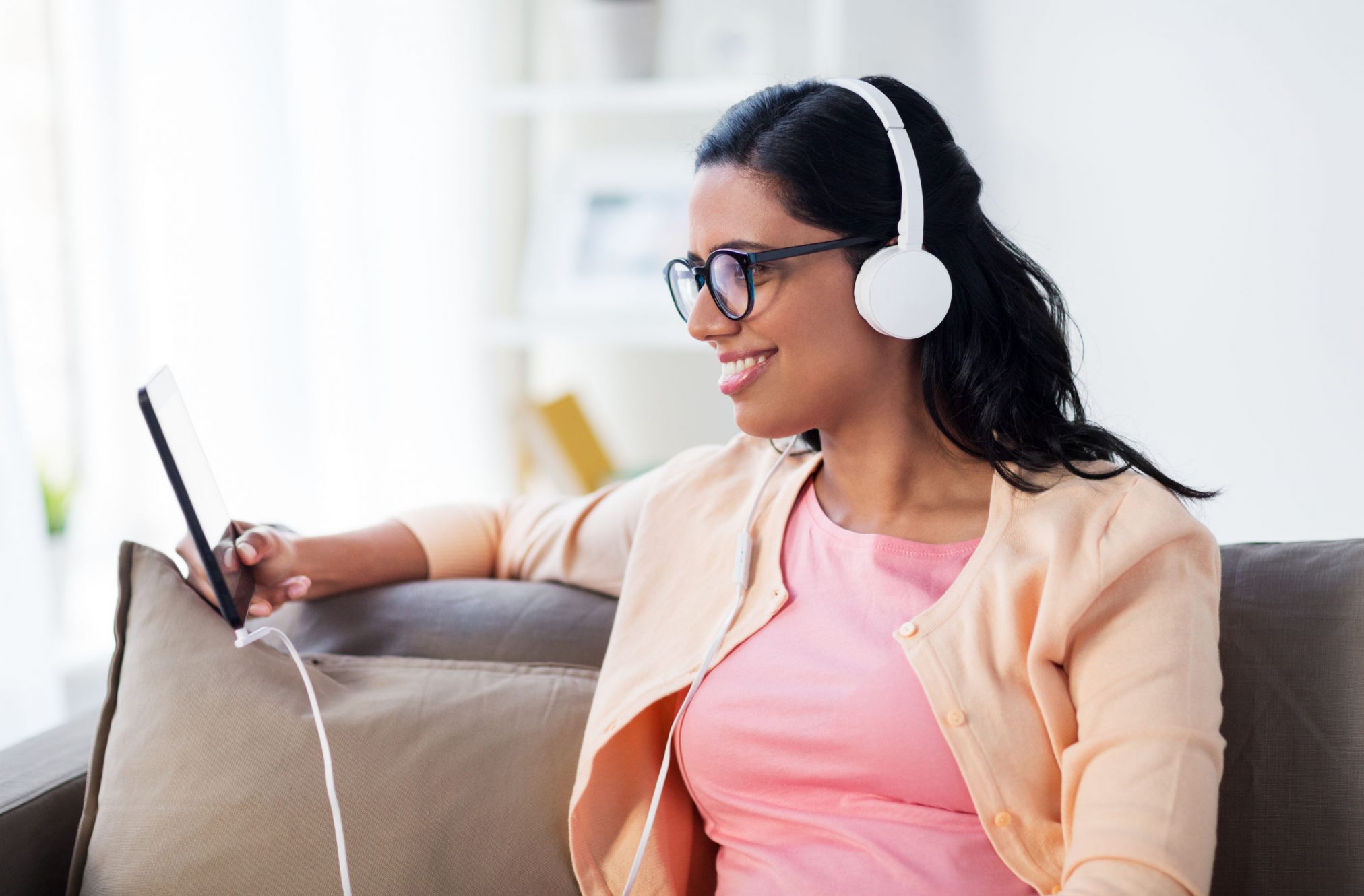 woman listening to podcast