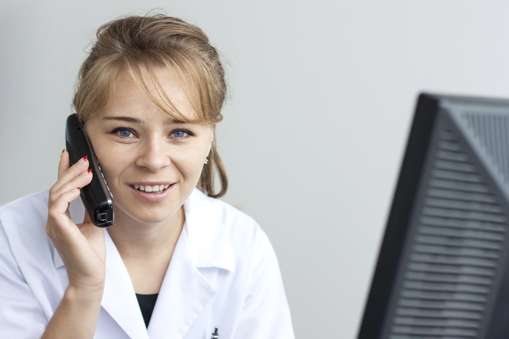 busy pharmacist on phone