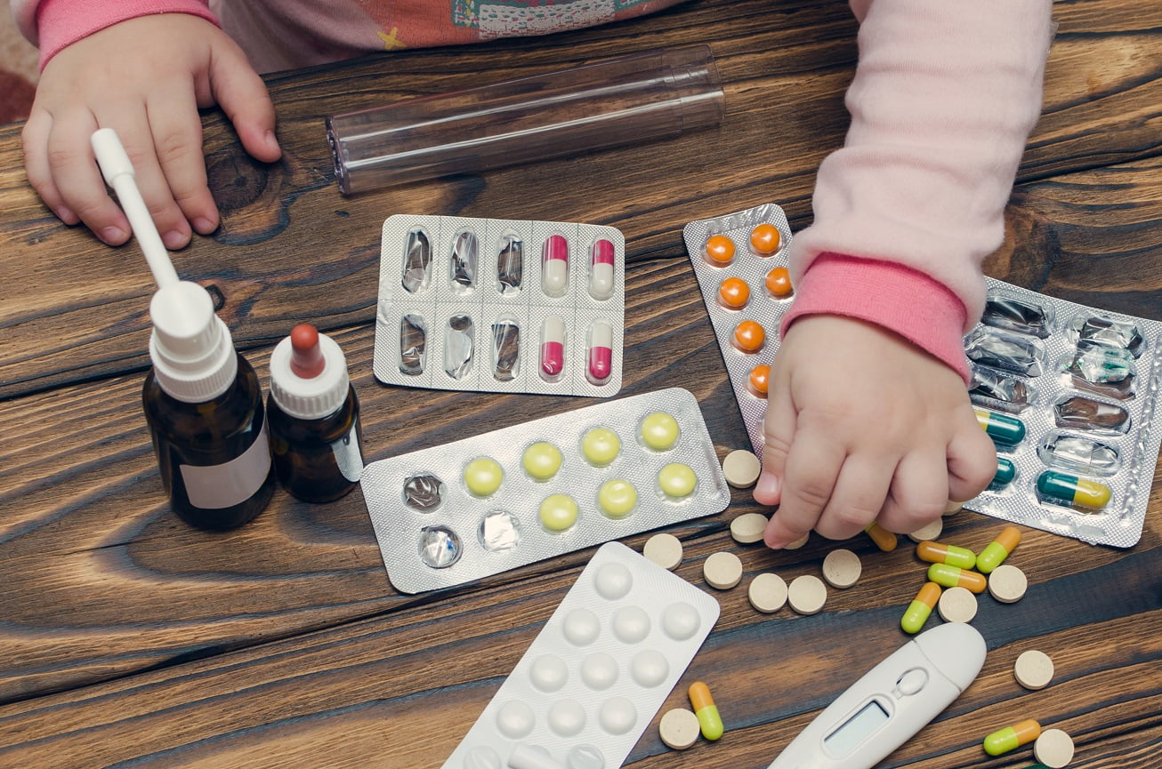child holding pills