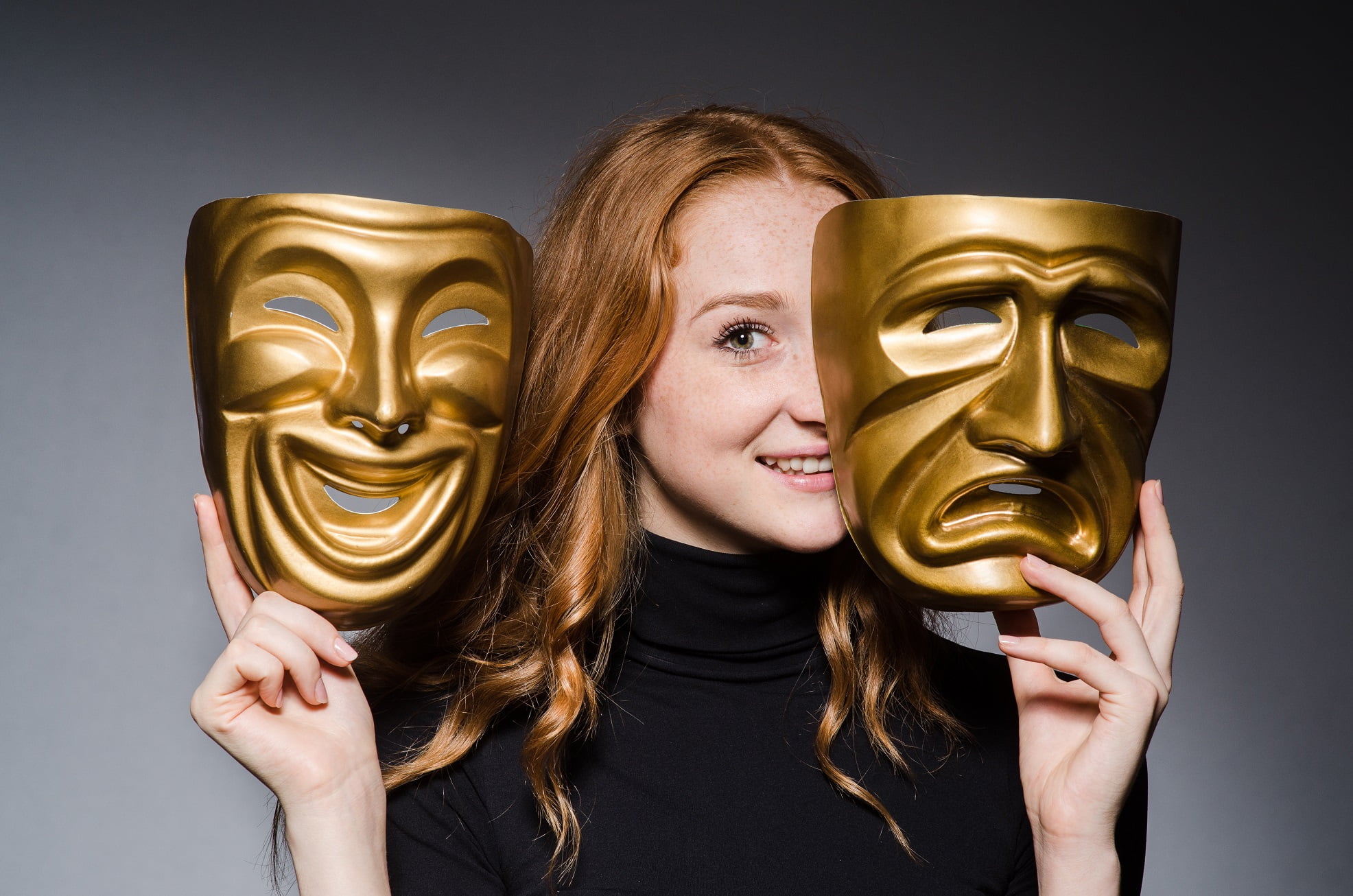 redhead woman with two theatre masks - comedy and tragedy