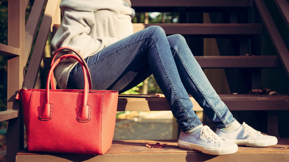 woman with large red handbag