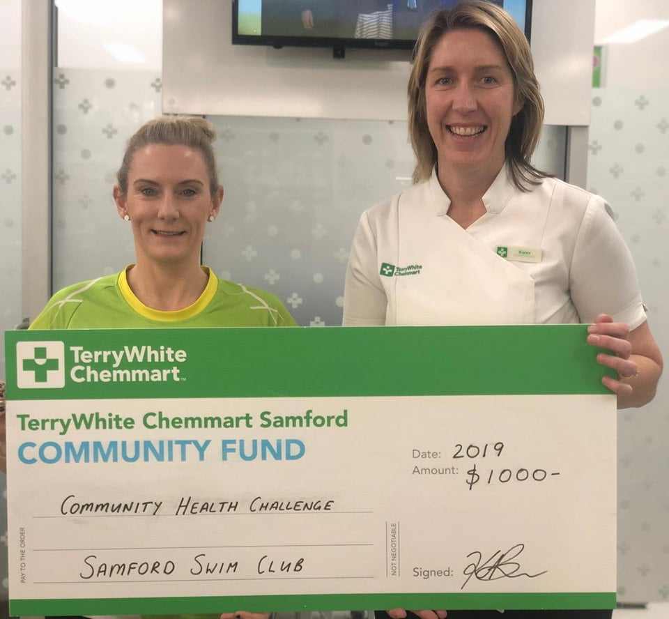 Kylie Carrett with Karen Brown holding a big cheque