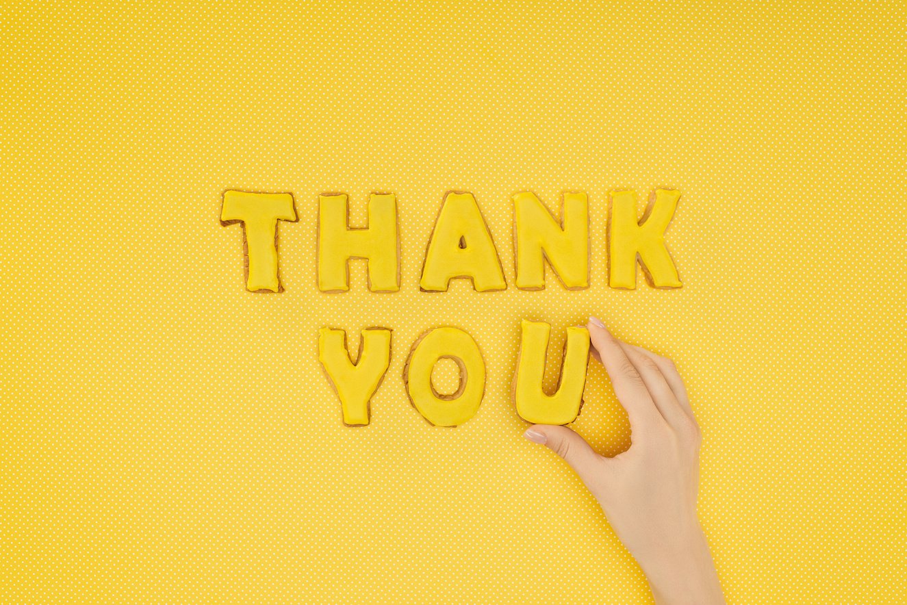 yellow background, thank you in letters