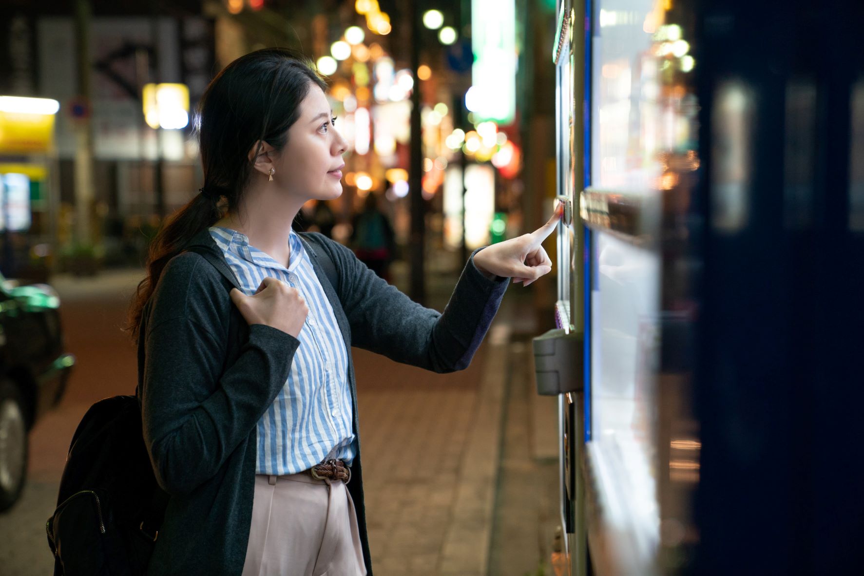 woman at vending machine