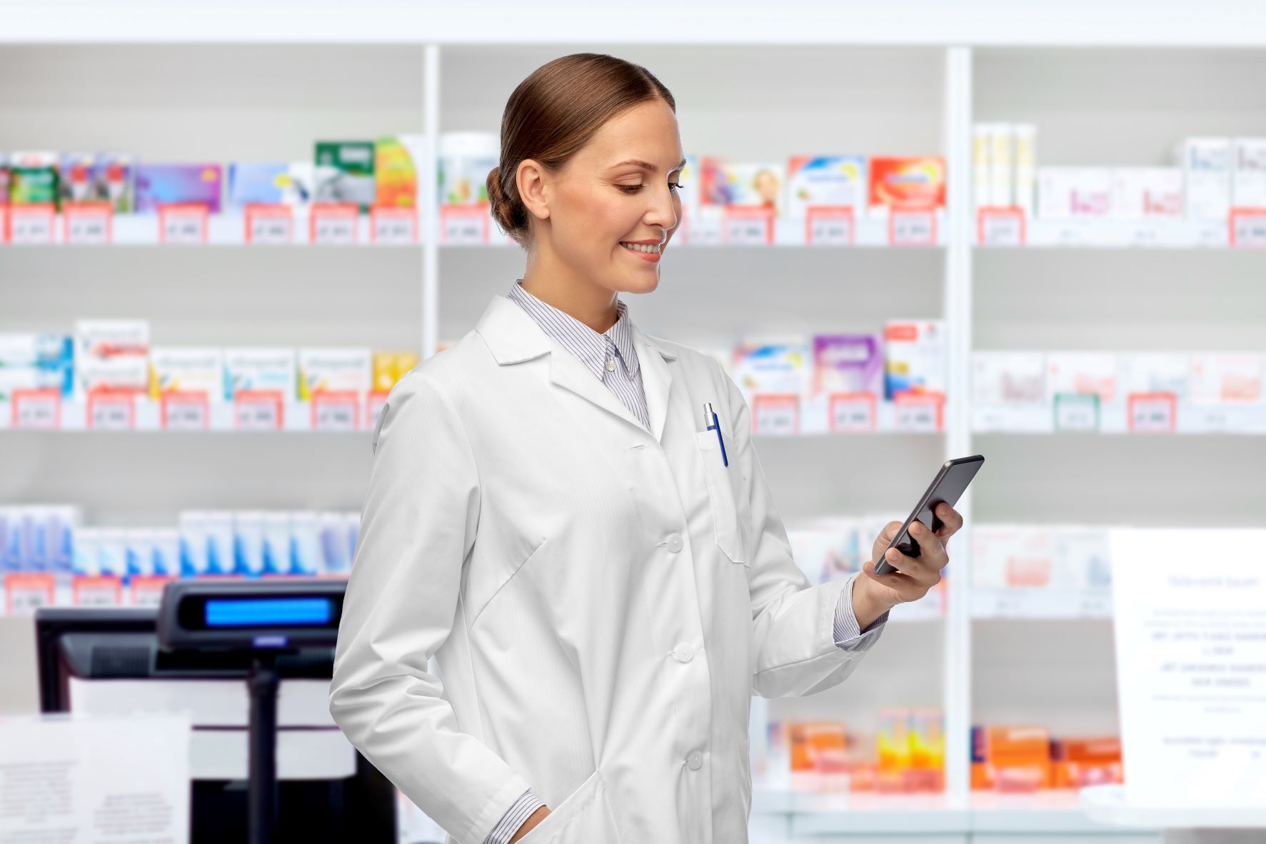 pharmacist smiling at phone