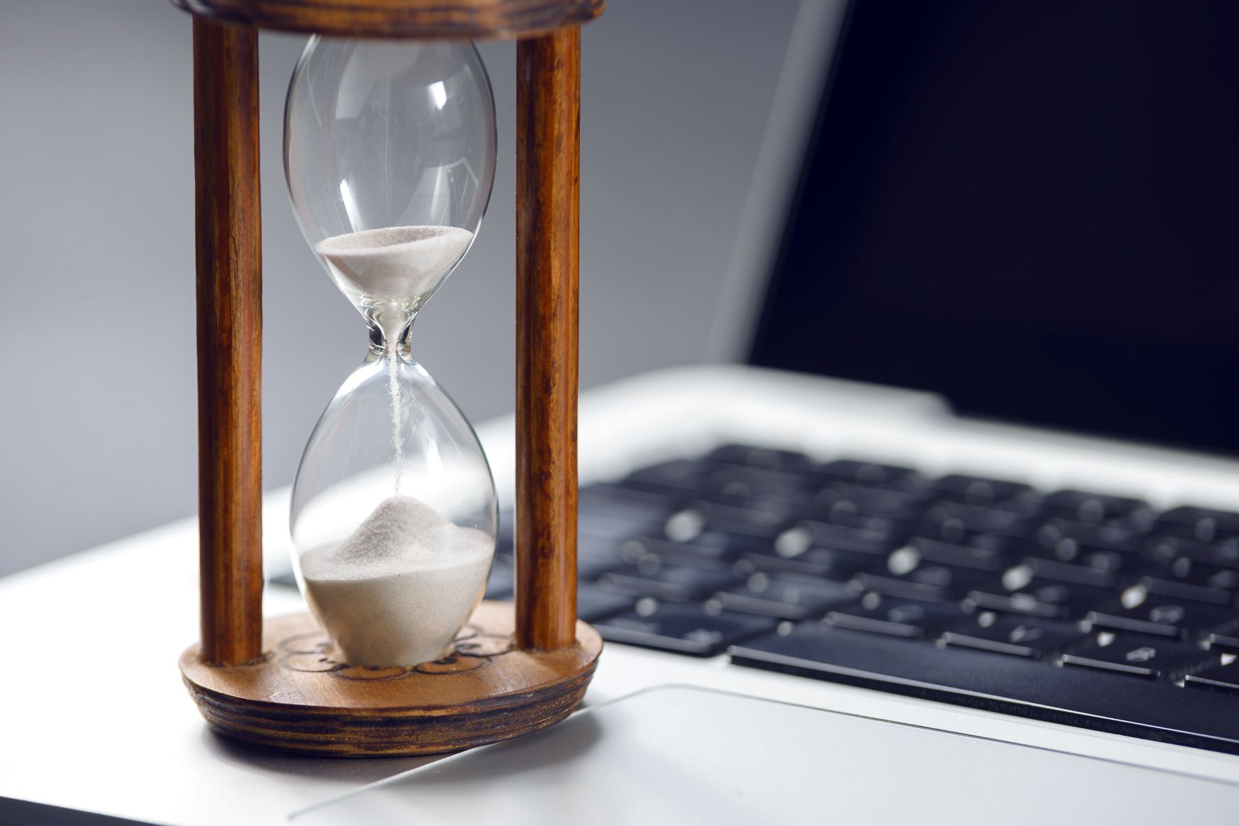 hourglass by laptop