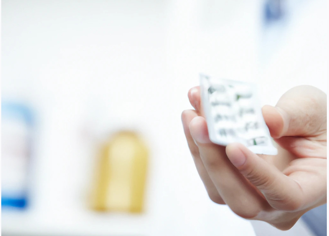 pharmacist dispensing emergency supply of medication